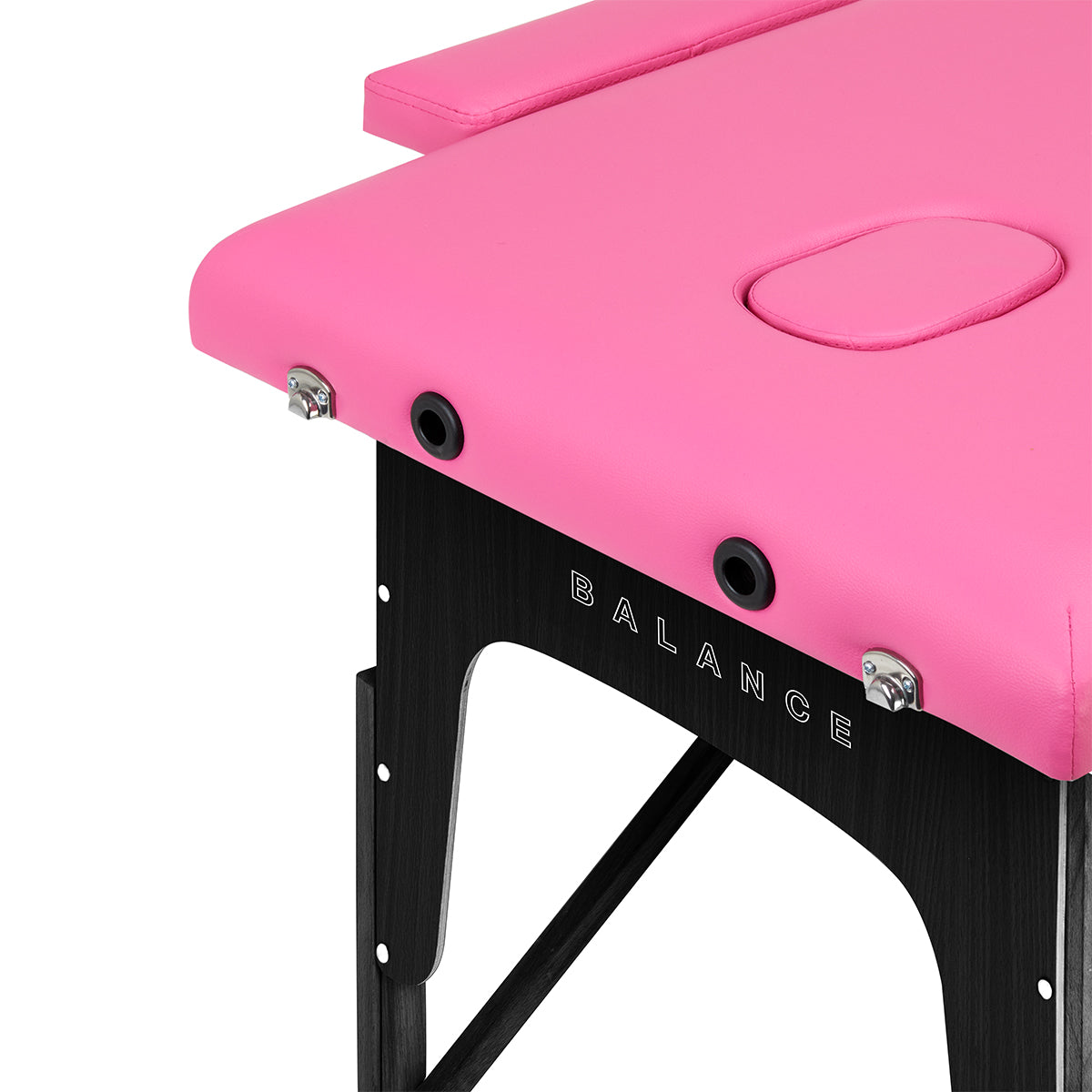 BALANCE wooden folding massage table with pink and black upholstery, featuring two adjustable segments for massage therapy.