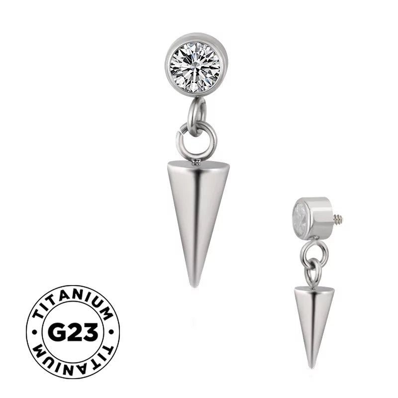 Titanium ring with spike bezel design, showcasing a sleek, modern jewelry piece with textured spikes on a smooth band.