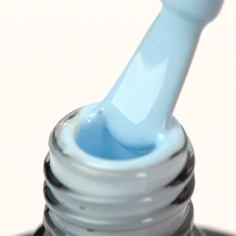 OCHO NAILS Hybrid nail polish in blue 502, 5g bottle, showing the vibrant blue color and sleek packaging.