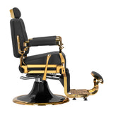 Gabbiano Leonardo Gold and Black barber chair with padded seat and backrest, chrome accents, and adjustable headrest in a barbershop setting.
