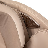 White Sakura Prime 101 massage chair with padded armrests and sleek design, showcasing modern massage furniture.