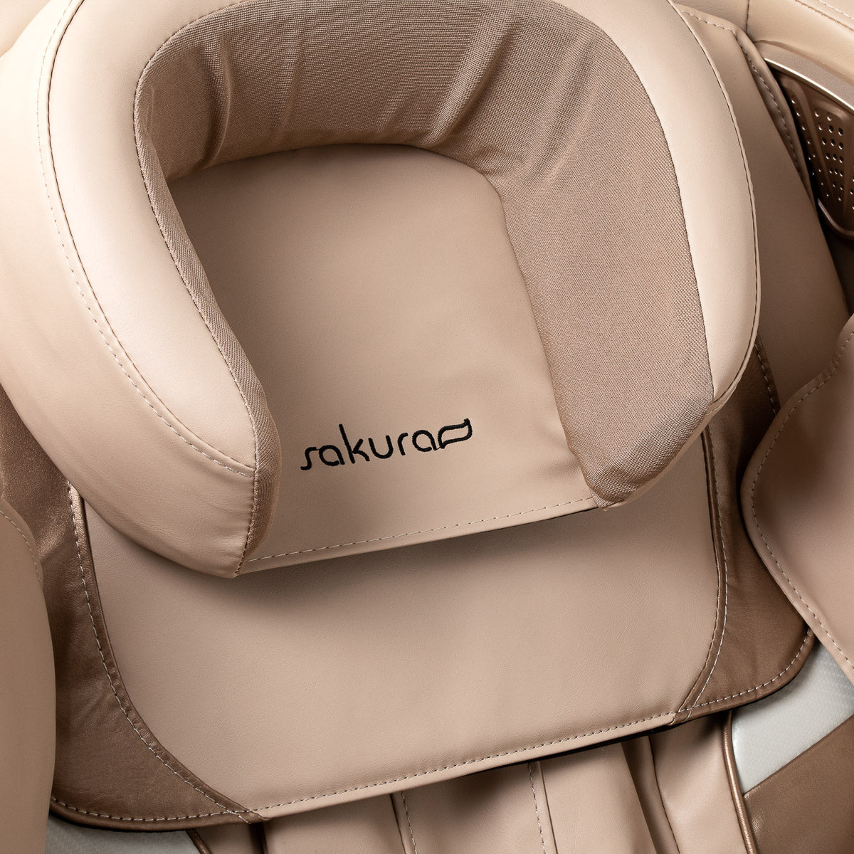 White Sakura Prime 101 massage chair with padded cushions and sleek design, showcasing modern massage furniture.