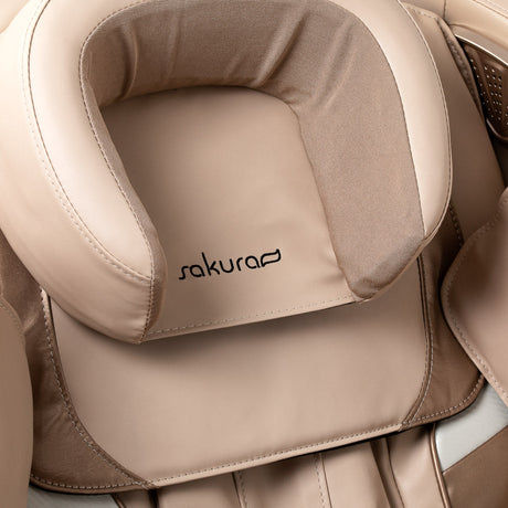 White Sakura Prime 101 massage chair with padded cushions and sleek design, showcasing modern massage furniture.