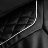 Black Sakura Prime 108 massage chair with padded armrests and sleek design, showcasing comfortable massage furniture.