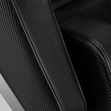 Black Sakura Prime 108 massage chair with padded armrests and built-in control panel, showcasing a modern massage furniture design.