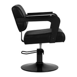 Black HAIR SYSTEM Jet Noir hairdressing chair with padded seat and backrest, adjustable height and chrome base.