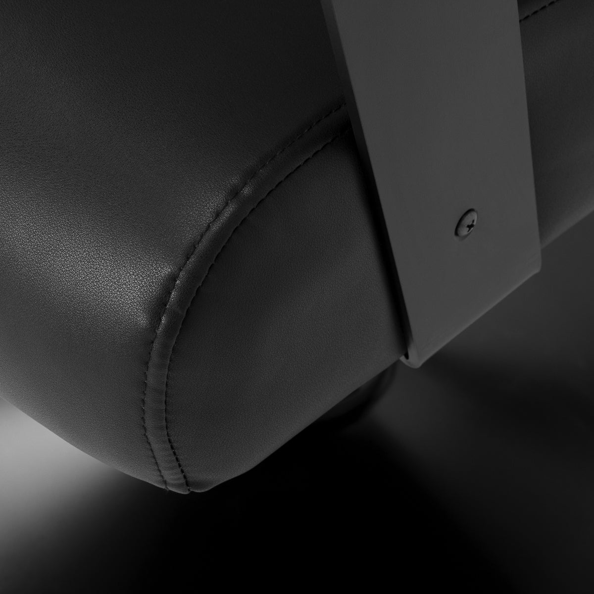 Black Jet noir hairdressing chair from HAIR SYSTEM with padded seat and adjustable height for salon styling.