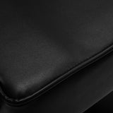 Black Hair System hairdressing chair in a professional salon setting with a sleek, modern design and adjustable features.