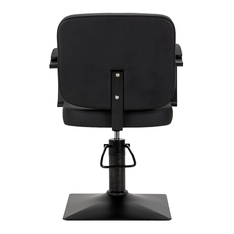 Black HAIR SYSTEM Edge hairdressing chair with cushioned seat and adjustable height for salon use.