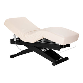 Cream SPA lounger Sillon Siesta with black base, beauty salon furniture for comfortable client seating and relaxation.