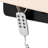 Cream SPA lounger Sillon Siesta with black base for beauty salon furniture, showcasing a comfortable, modern design.