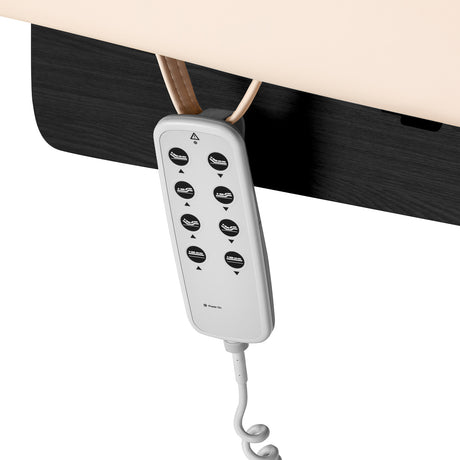 Cream SPA lounger Sillon Siesta with black base for beauty salon furniture, showcasing a comfortable, modern design.