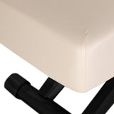 Cream SPA lounger Sillon Siesta with black base, designed for beauty salon furniture, showcasing a comfortable and stylish treatment bed.