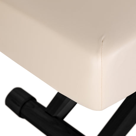 Cream SPA lounger Sillon Siesta with black base, designed for beauty salon furniture, showcasing a comfortable and stylish treatment bed.