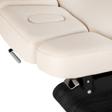 Cream-colored SPA lounger Sillon Relax with black base, ideal for beauty salon furniture, featuring a comfortable, stylish design.