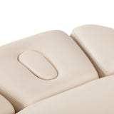 Cream-colored SPA lounger Sillon Relax with black base, designed for beauty salon furniture, ideal for relaxing treatments.
