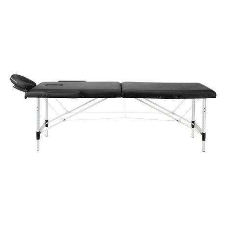 BALANCE aluminium folding massage table with two segments in black, featuring a sturdy frame and padded surface for comfort.