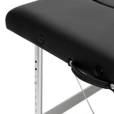 Black BALANCE aluminium folding massage table with two segments, featuring a sturdy, lightweight design for professional massage therapy.