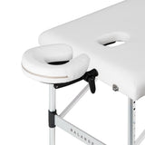 White BALANCE aluminium folding massage table with three segments, designed for professional massage therapy and easy portability.