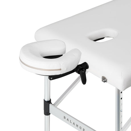 White BALANCE aluminium folding massage table with three segments, designed for professional massage therapy and easy portability.