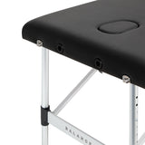BALANCE aluminium folding massage table with three segments in black, featuring a sturdy frame and cushioned surface for comfort.