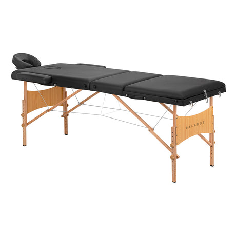 Black BALANCE wooden folding massage table with three segments, featuring a sturdy design and adjustable headrest for comfortable massages.