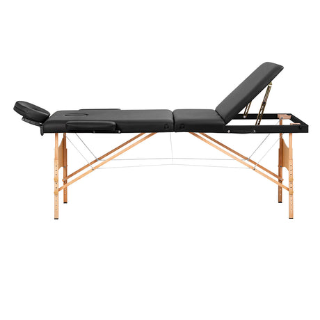 Black BALANCE wooden folding massage table with three segments, designed for professional massage therapy and easy portability.