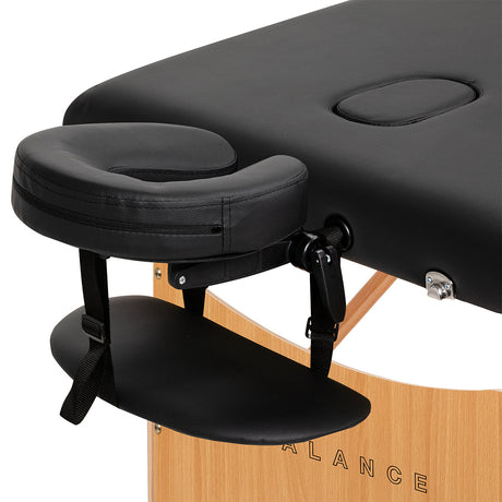 Black BALANCE wooden folding massage table with three segments, designed for professional massage therapy and portable comfort.