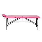 BALANCE wooden folding massage table with pink and black upholstery, featuring two adjustable segments for massage therapy.