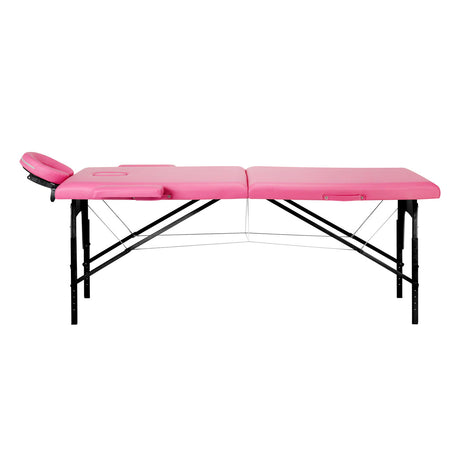 BALANCE wooden folding massage table with pink and black upholstery, featuring two adjustable segments for massage therapy.