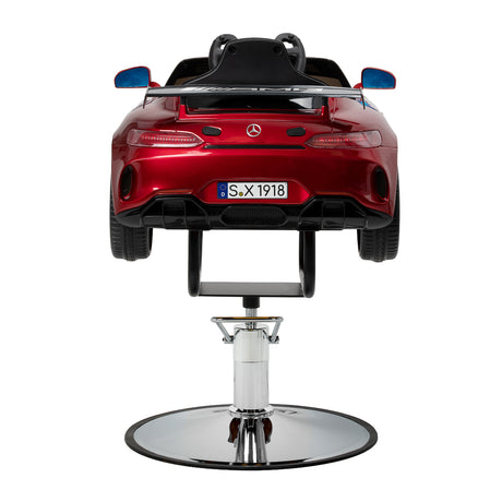 Red kids salon chair with steering wheel and seatbelts