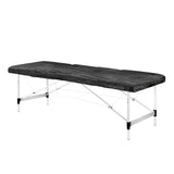 Black disposable plastic sheet with elastic band, ideal for protective covering by EL CARTEL.