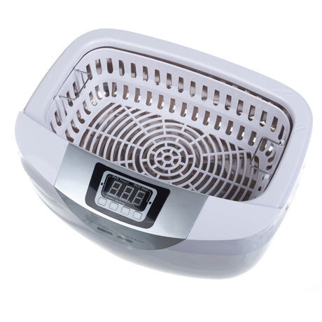 Ultrasound cleaning brush in a 2.5L basin by Beauty System, with digital control panel and stainless steel interior.