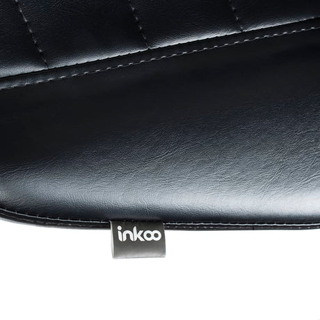Tattoo artist armrest and stool by SIMI INKOO from Beauty System, featuring comfortable padding and adjustable height for tattoo sessions.