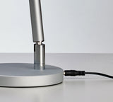 Beauty System PROMED LTL-749 LED table lamp with non-shadow lighting on a modern desk or bedside table.