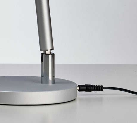 Beauty System PROMED LTL-749 LED table lamp with non-shadow lighting on a modern desk or bedside table.
