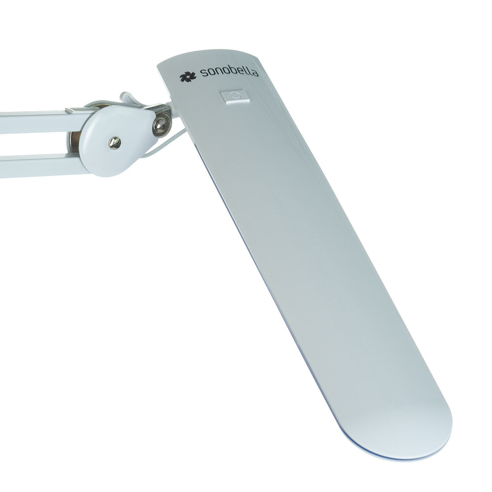 White BSL-52 LED 12W clip-on workshop lamp by Beauty System, with adjustable arm and bright illumination for workspaces.