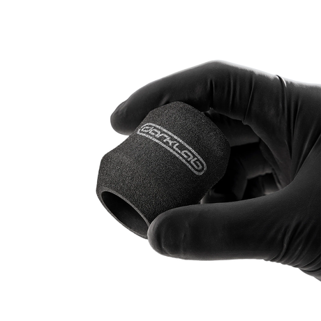 FK Irons Ergo Disposable Foam Grip Covers shown on tattoo machine for comfortable, hygienic grip during tattooing.