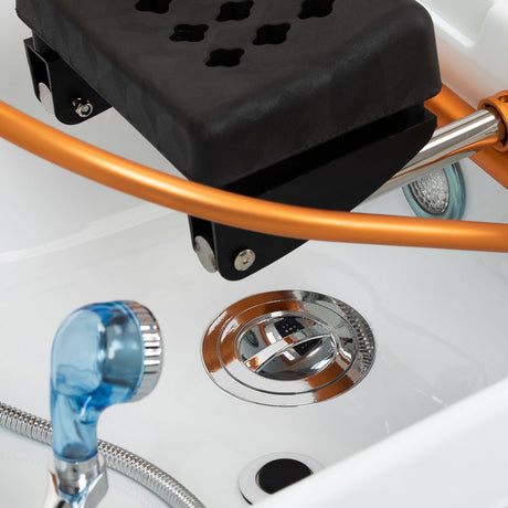 Gabbiano Head Spa Maldives hair washing bed in beige with cushioned surface and headrest for relaxing hair treatments.