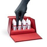 The Pigment PMU Lip Pigment Collection with 8 bottles of lip pigments in 15ml bottles, displayed in a row.