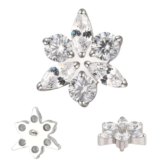 Titanium ring with star and flower engravings, stylish jewelry by BVShop, showcasing detailed craftsmanship and sleek design.